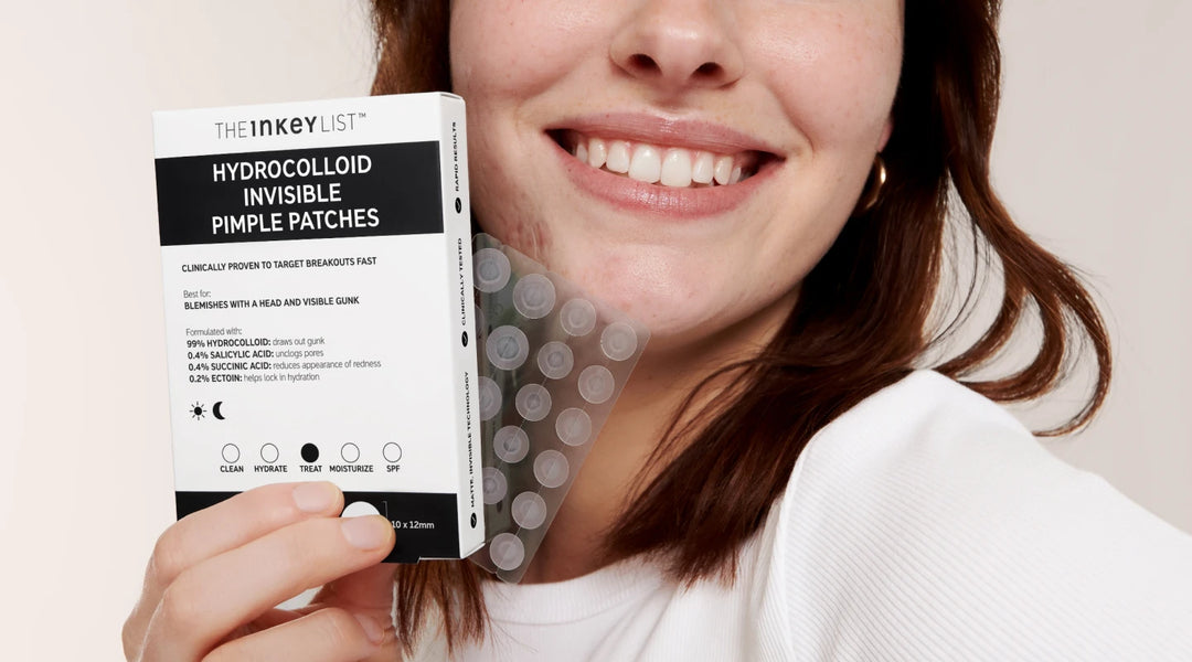 Model holding a pack of Hydrocolloid Invisible Pimple Patches