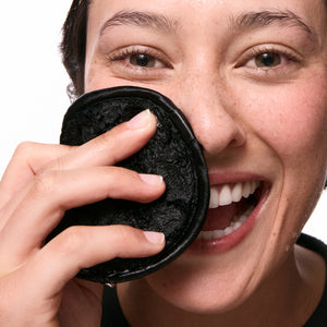 Model with damp skin and cleansing pad