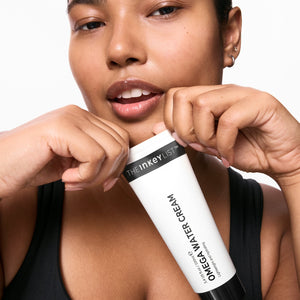 Model holding Omega Water Cream