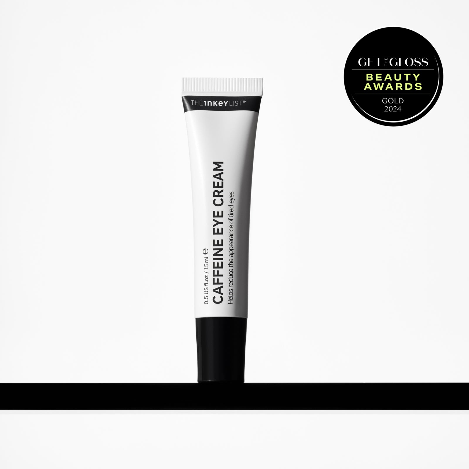 Caffeine Eye Cream on a shelf with award badge