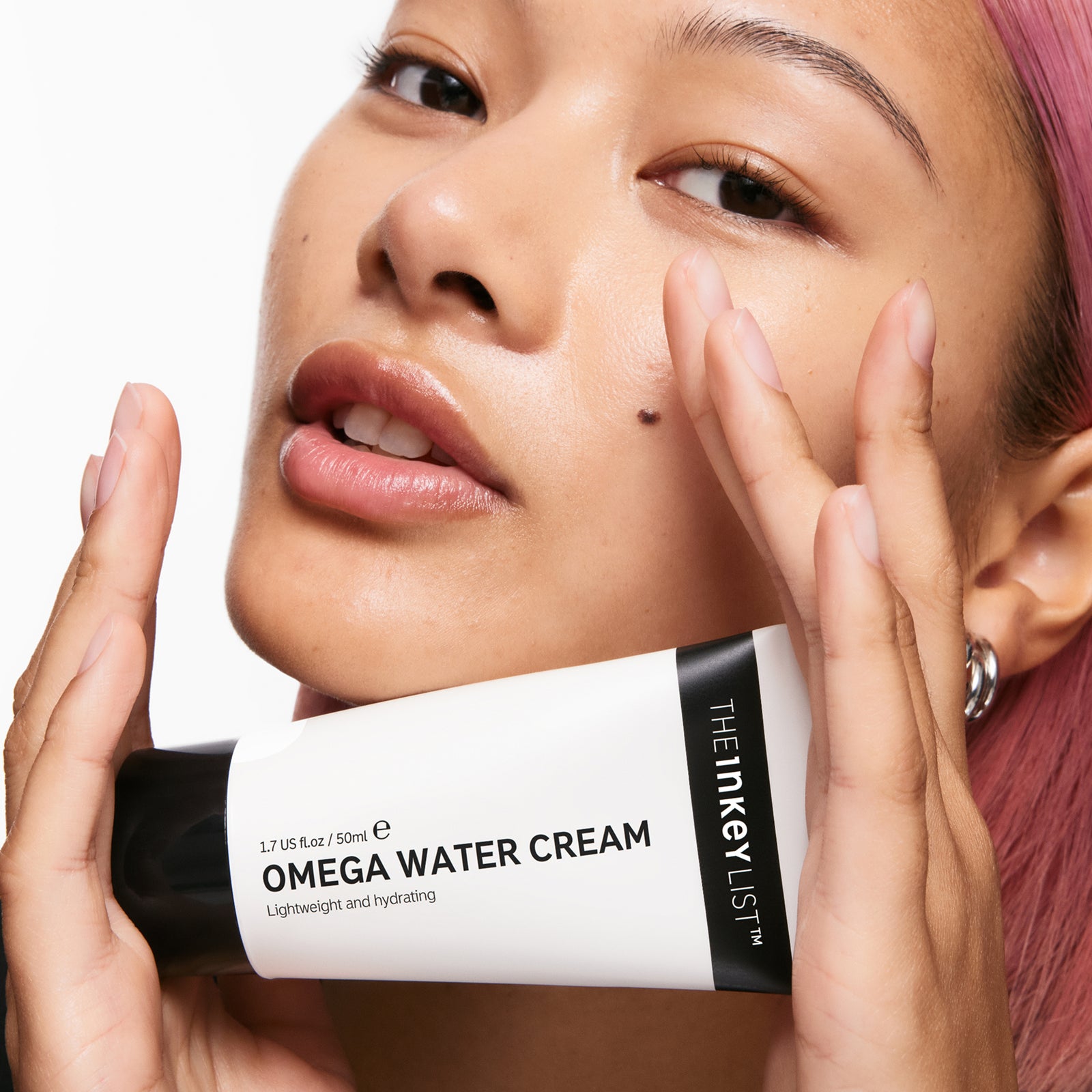 Model holding Omega Water Cream