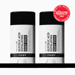 Two 'The Inkey List' glycolic acid exfoliating body sticks with a 'Best of Beauty' Allure award badge on a white background.