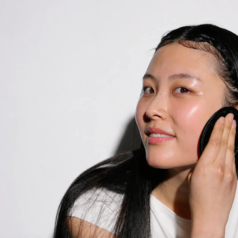woman removing her makeup