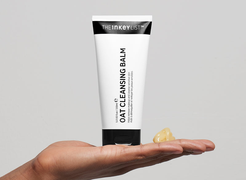 Oat cleansing balm on model's palm