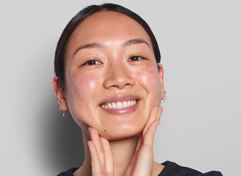 Model holding her face