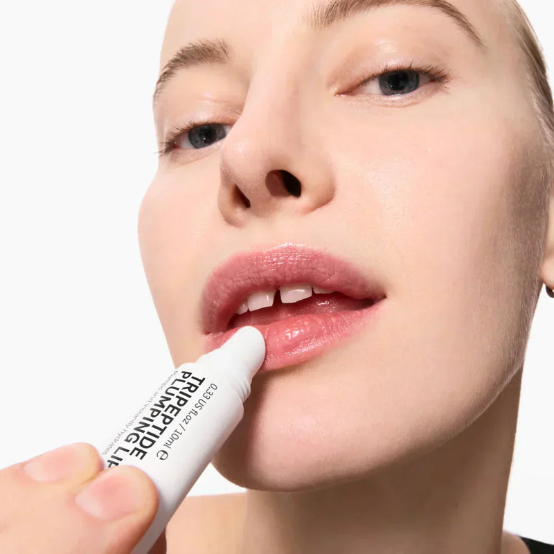 woman applying lip balm 
