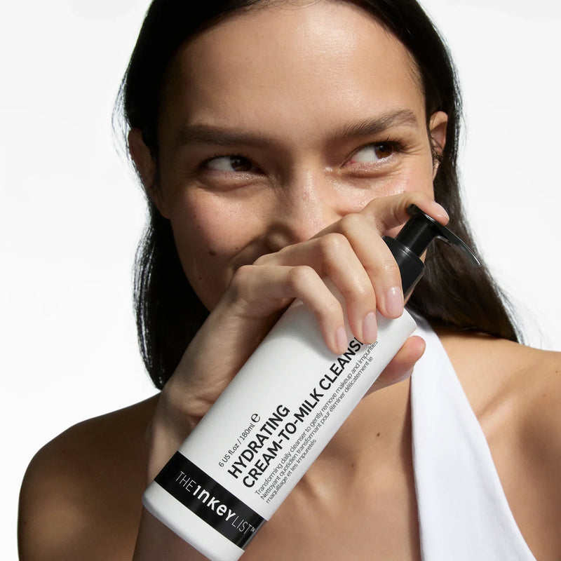 woman holding milk cleanser