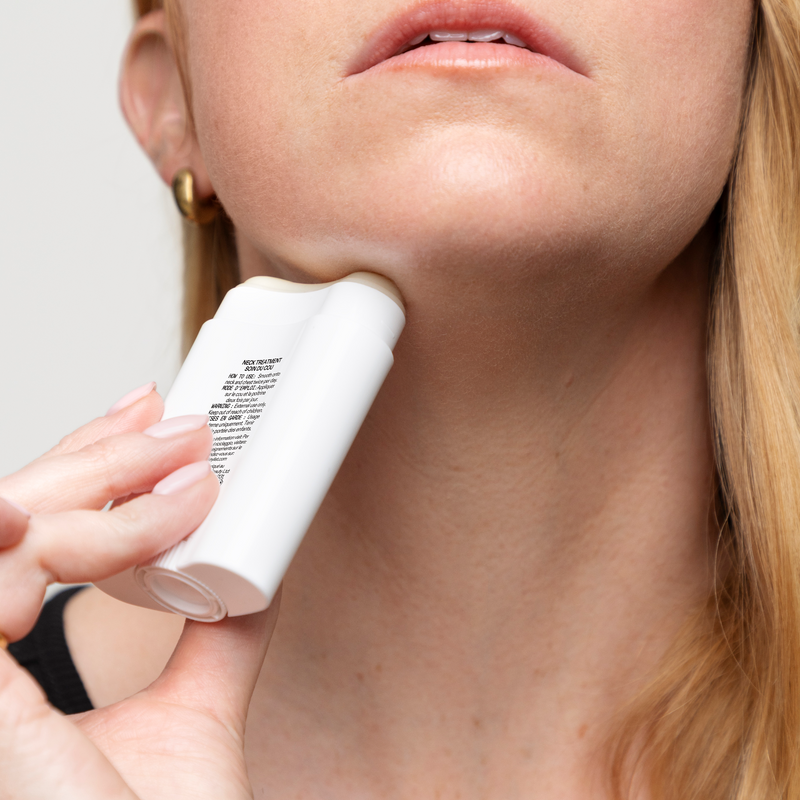 woman applying neck stick