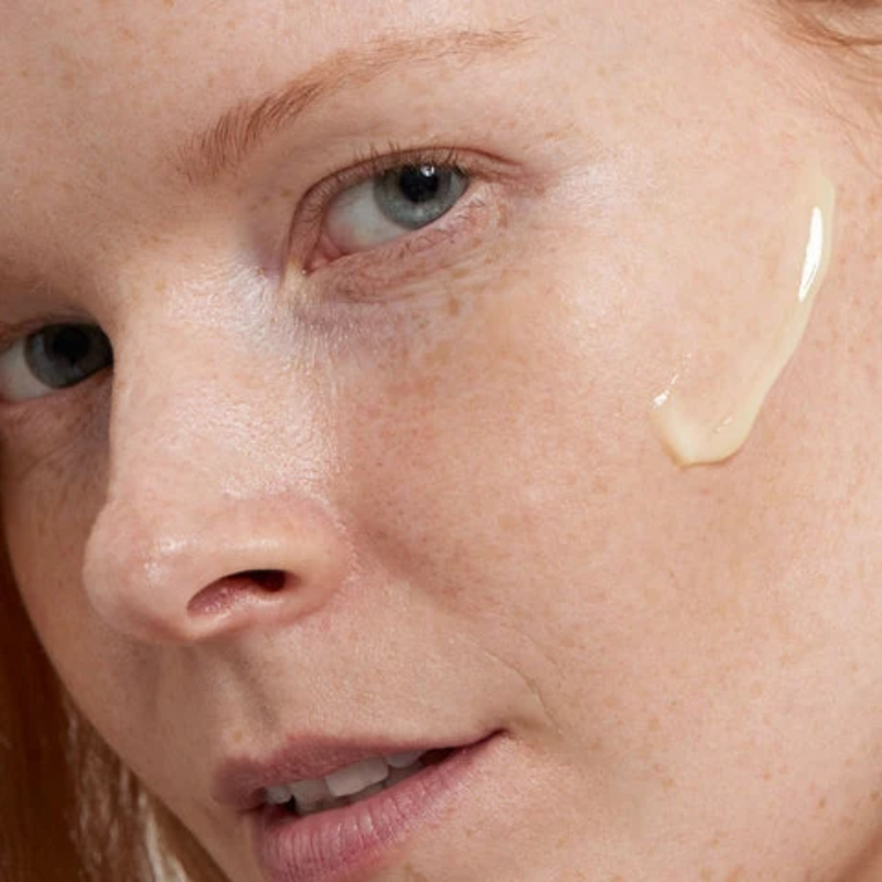 woman with cream on her face