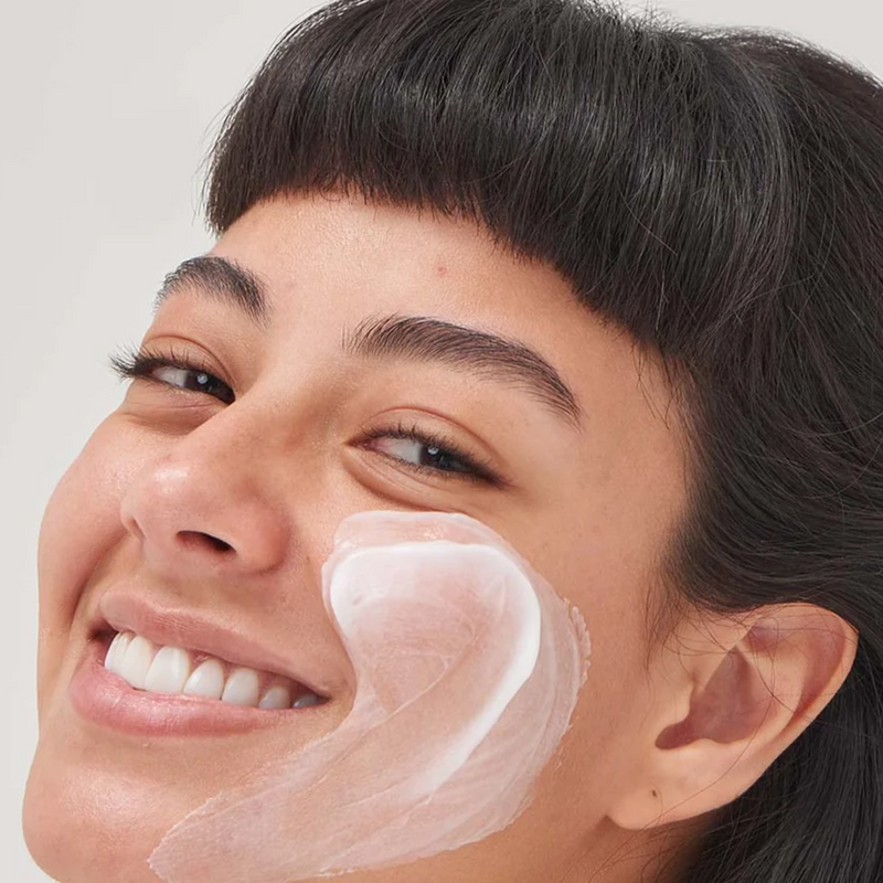 woman with moisturiser on her face