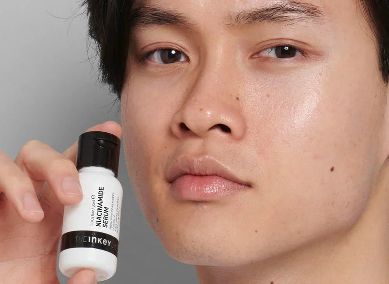 Man holding serum bottle