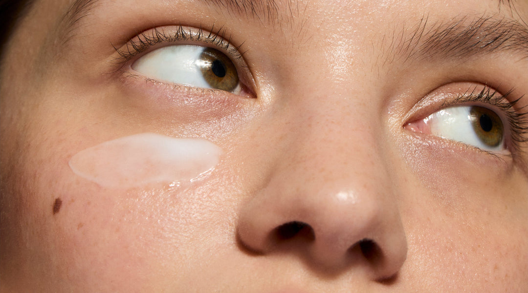 Model applying skincare swatch