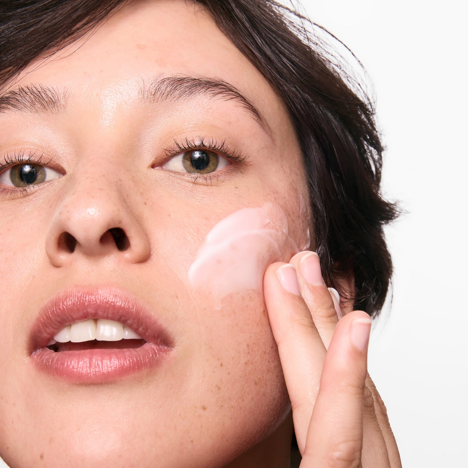 Model applying Omega water cream