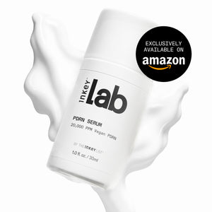 A white cylindrical bottle of Inkeylab PDRN Serum floating over a white liquid splash on a white background, with a black circular badge in the top right that reads 'EXCLUSIVELY AVAILABLE ON amazon'.