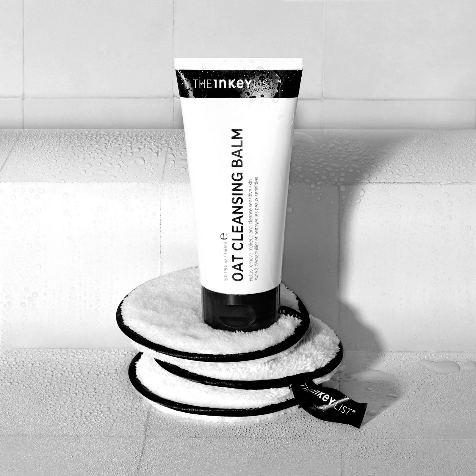 Oat Cleansing Balm 150ml & 3x cotton cleansing pads on white tile