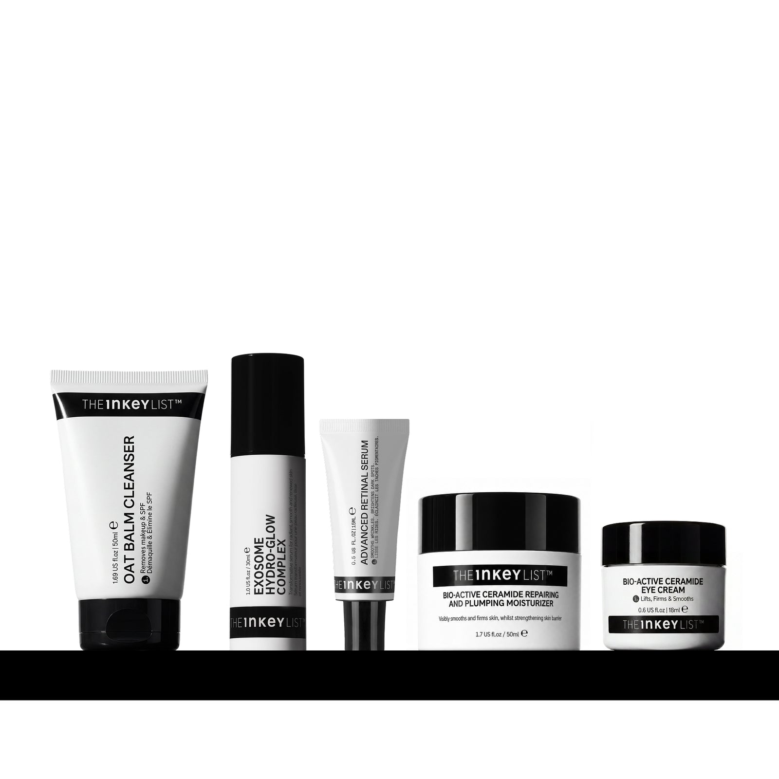 Five skincare products from The Inkeyist brand arranged in a row on a black surface against a white background. The products include an oat balm cleanser tube, Exosome Glow Complex, Advanced Retinal, Bio-Active Ceramide Eye Cream, and a Bio-Active Ceramide Moisturiser.