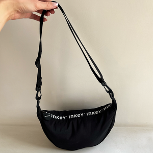 Hand holding the limited edition INKEY bag
