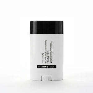 White skincare stick with black cap on a white background