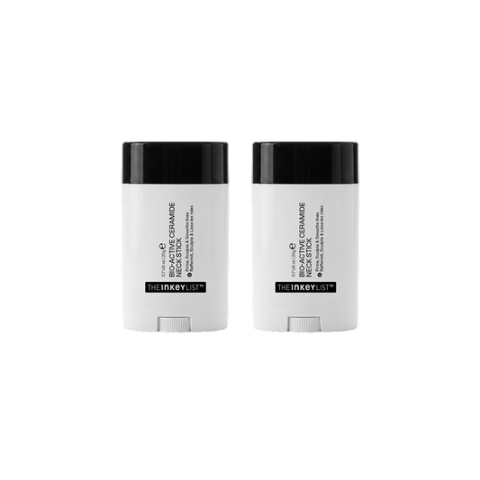 Two white and black stick containers of The Inked List Neck Stick, displayed side-by-side on a solid white background.