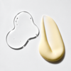 A clear gel-like droplet and a thick creamy beige product smear on a plain light background.
