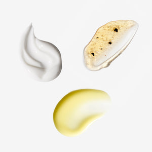 Three swatches of different skincare products on a white background