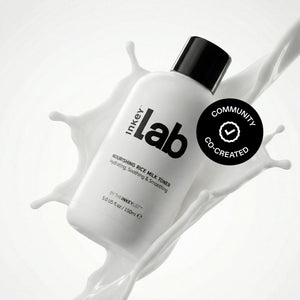 Inkey Lab skincare product with a splash of white liquid on a light gray background
