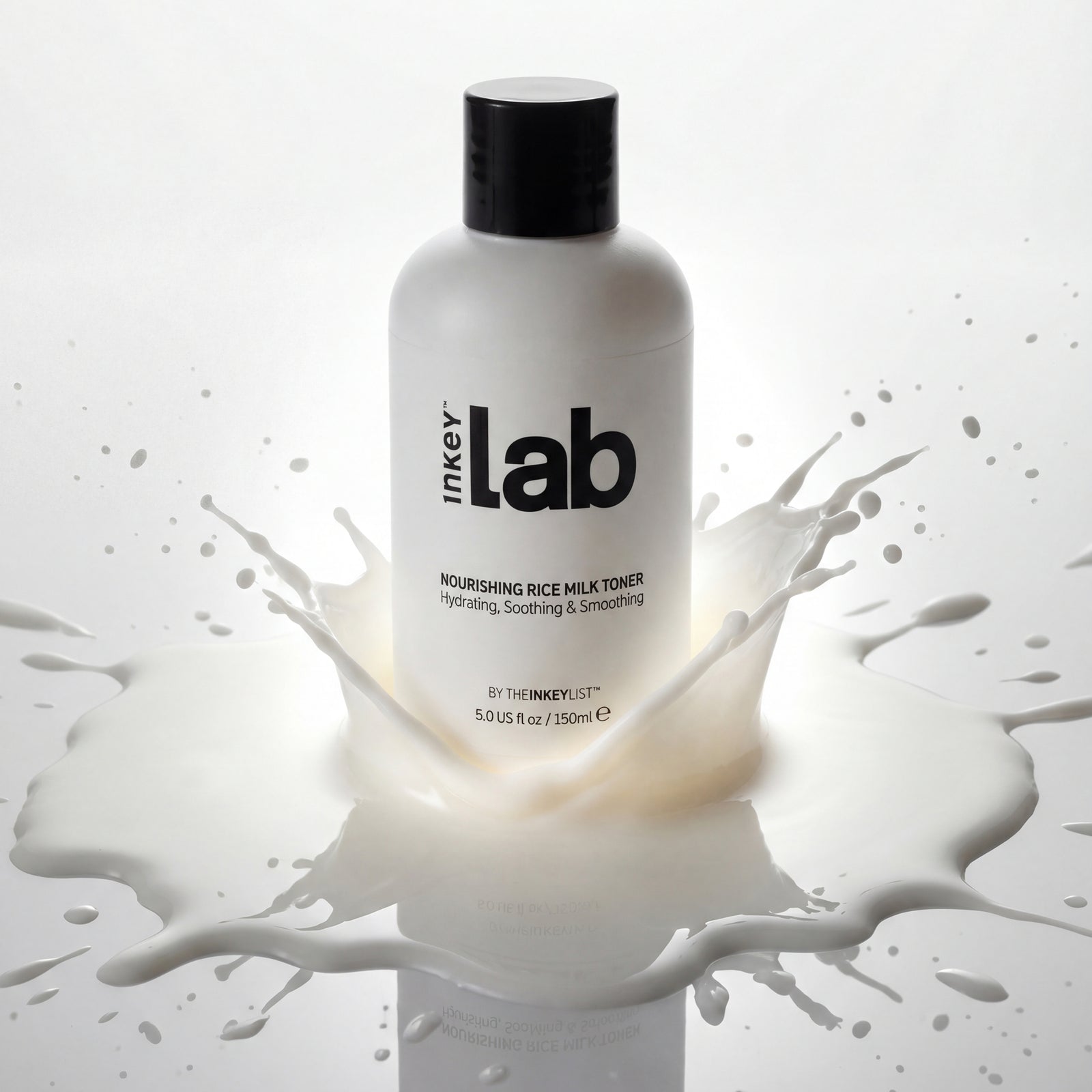 Inkey Lab skincare bottle with a splash of product on a light gray background