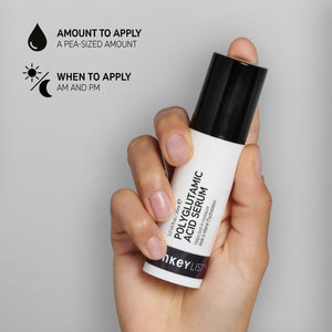 Hand holding a bottle of Polyglutamic Acid Serum against a grey background, with black text annotations to explain how and when to use it with text that reads 'Amount to apply (pea-sized amount)' and 'When to apply (AM and PM)'