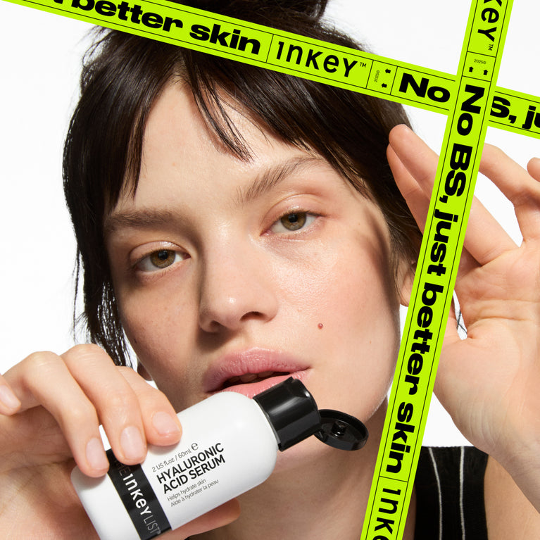 Person holding a Inkey Line skincare product with No BS just better skin text overlay.