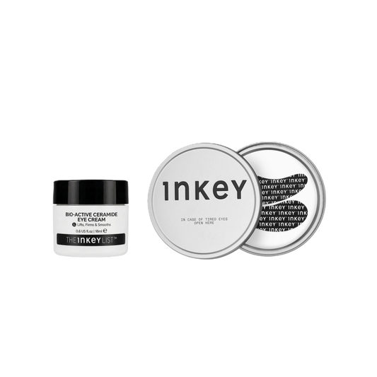 The Inkey Bio-Active Ceramide Eye Cream in a white jar with a black lid, shown next to two silver round tins displaying the product's packaging details on a solid white background.