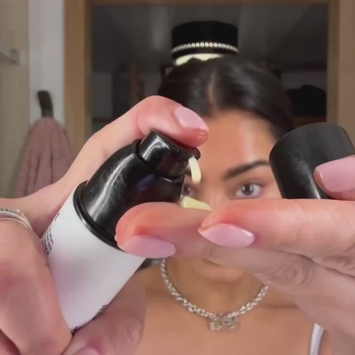 Woman applying Exosome serum