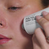 Woman applying SPF