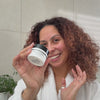 Woman applying BioActive Moisturizer