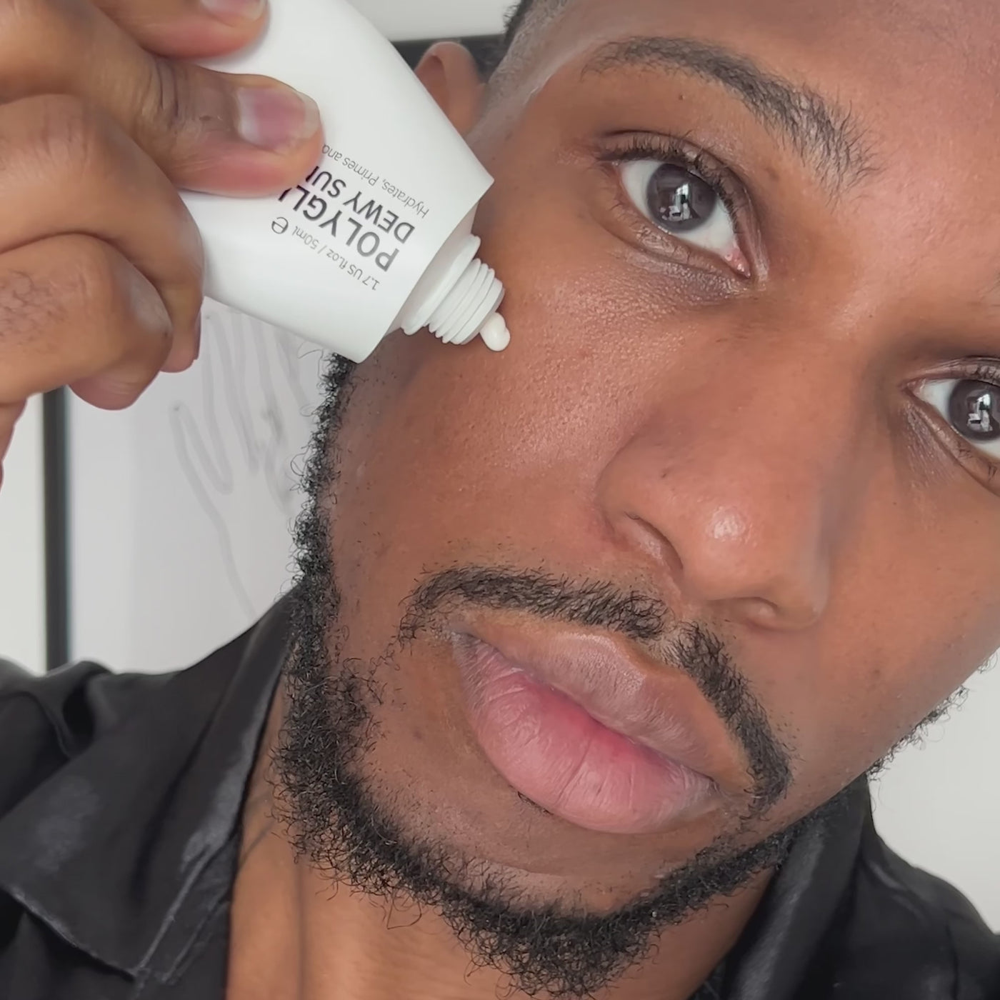 man applying SPF
