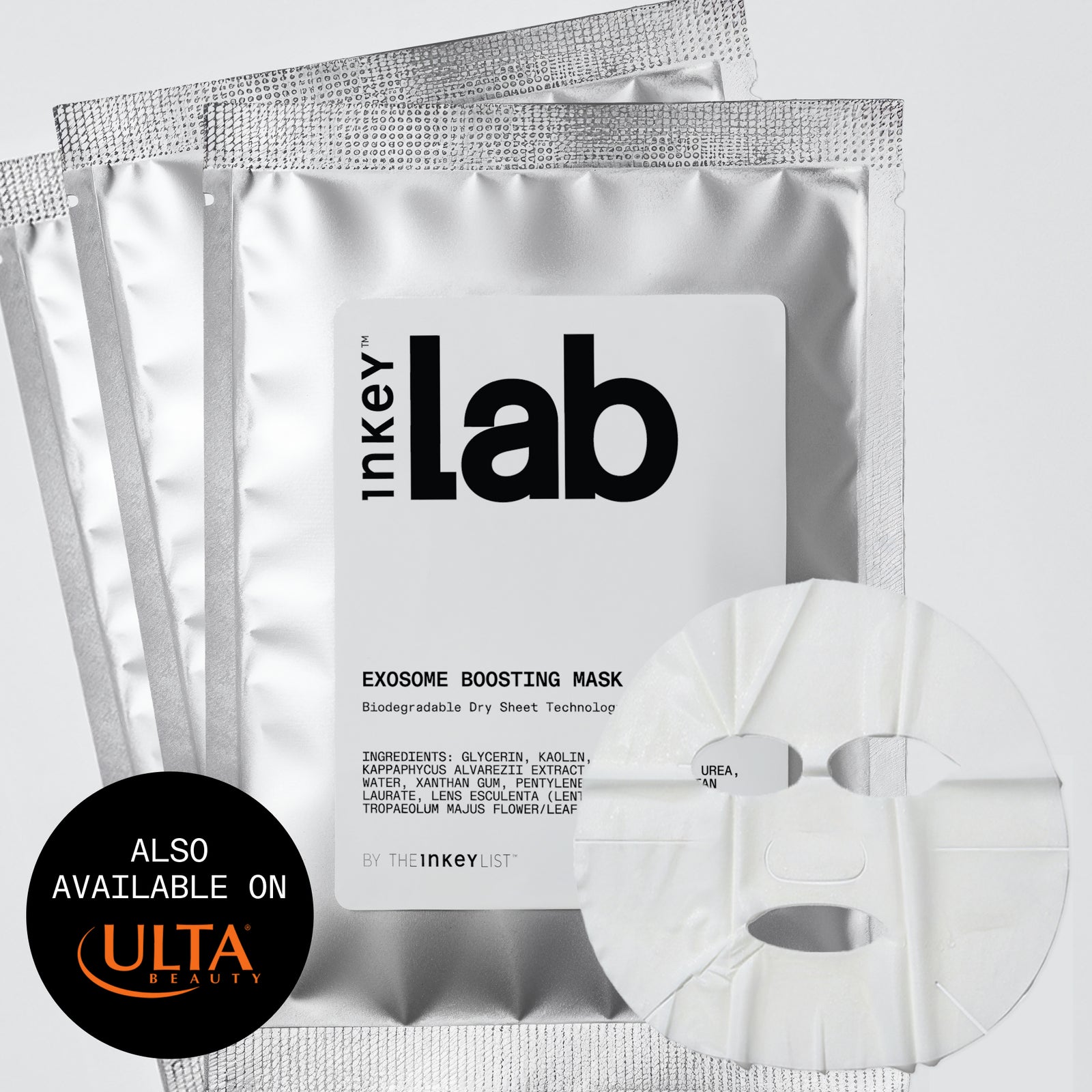 Three silver foil packets of inkey Lab Exosome Boosting Mask are arranged on a light gray background, with a white sheet mask partially visible in front and a black circular badge at lower left reading 'ALSO AVAILABLE ON ULTA BEAUTY'.