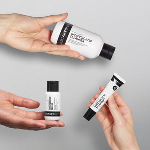 An image of hands holding each product from the Breakout Routine against a grey background