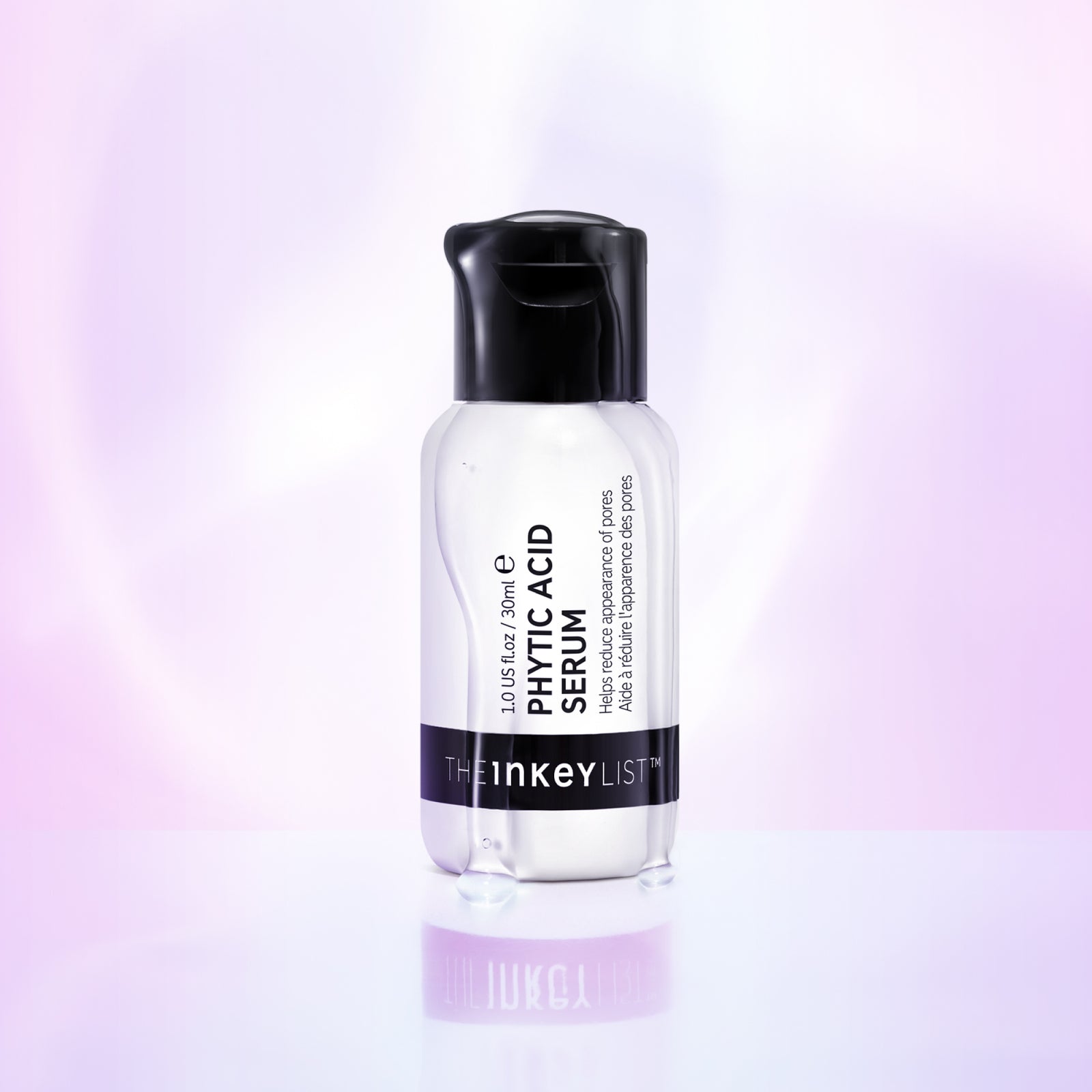 Phytic Acid Serum bottle against purple background with serum coming down the outside