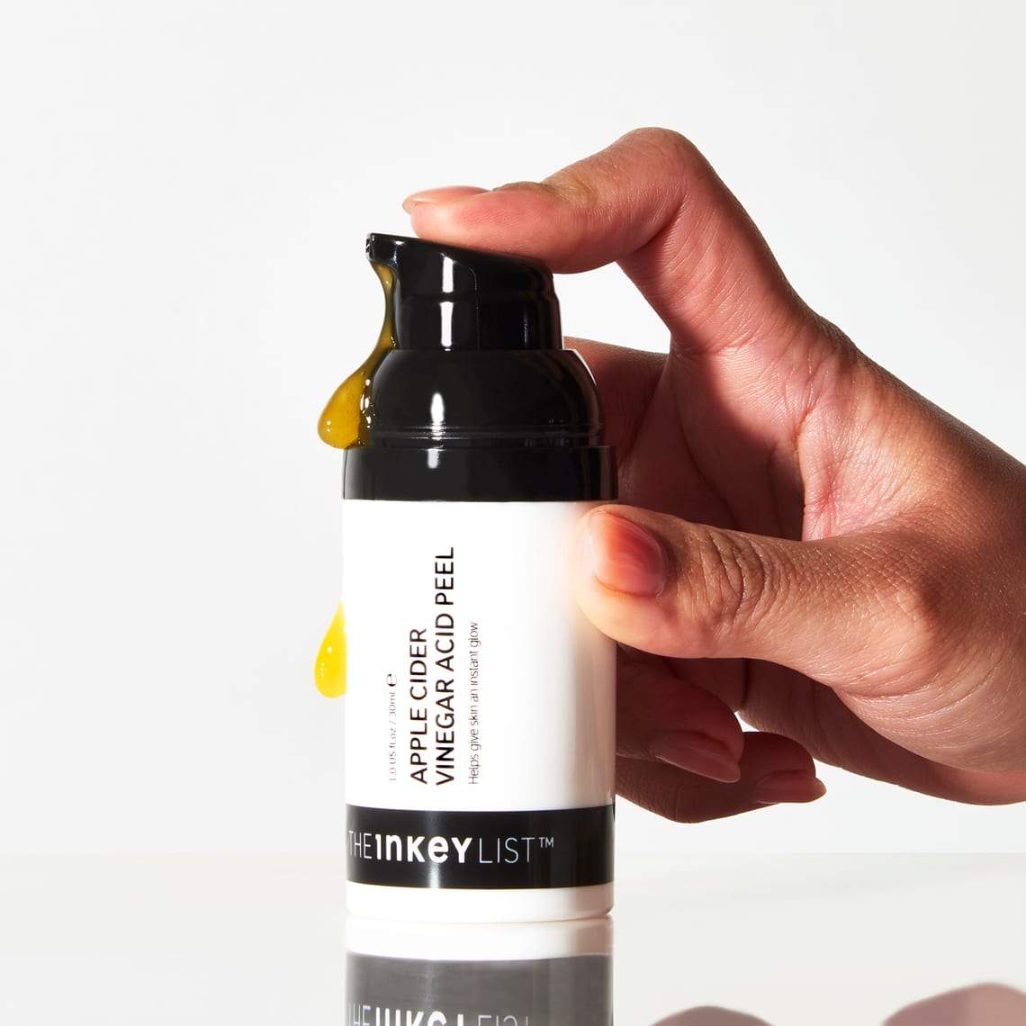 Apple Cider Vinegar Acid Peel bottle pump being pushed